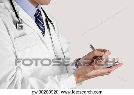 Doctor writing a prescription View Large Photo Image Stock Image - Doctor writing a prescription. Fotosearch