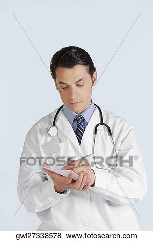Stock Photo - Doctor writing a prescription. Fotosearch