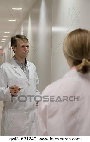 Doctors discussing in a hospital View Large Photo Image Stock Image - Doctors discussing in a hospital. Fotosearch