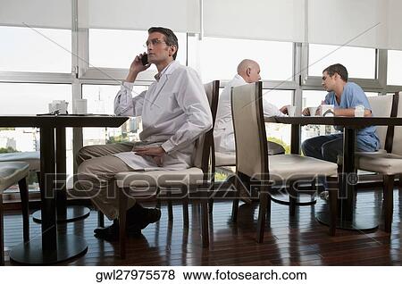 Doctors during coffee break a cafeteria View Large Photo Image Stock Photo - Doctors during coffee break a cafeteria. Fotosearch