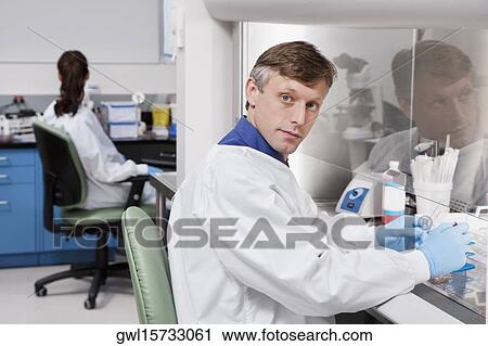 Doctors researching in a laboratory View Large Photo Image Stock Image - Doctors researching in a laboratory. Fotosearch