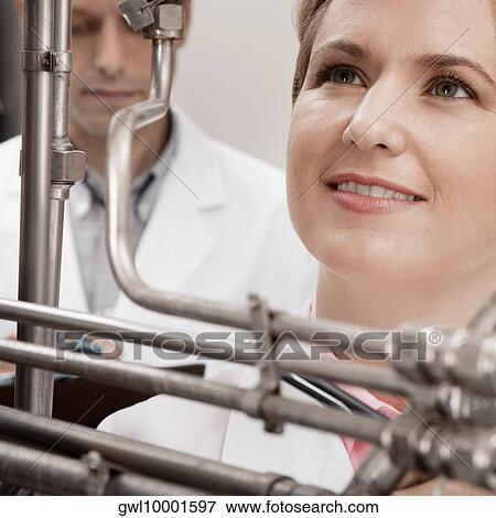 Doctors researching in a laboratory View Large Photo Image Stock Photo - Doctors researching in a laboratory. Fotosearch