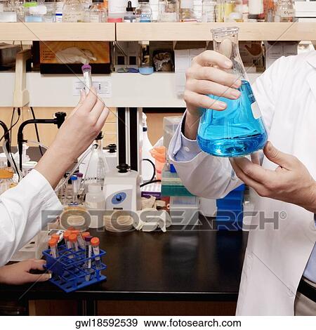 Doctors researching in a laboratory View Large Photo Image Stock Photo - Doctors researching in a laboratory. Fotosearch