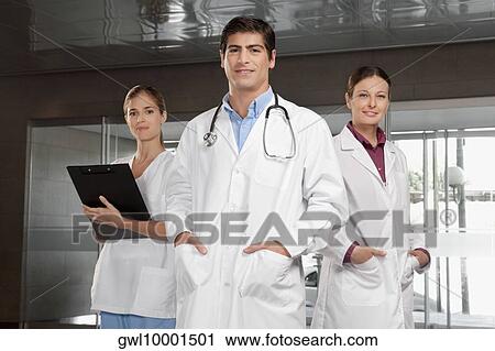Doctors standing together View Large Photo Image Stock Image - Doctors standing together. Fotosearch