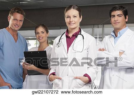 Doctors standing together View Large Photo Image Stock Image - Doctors standing together. Fotosearch