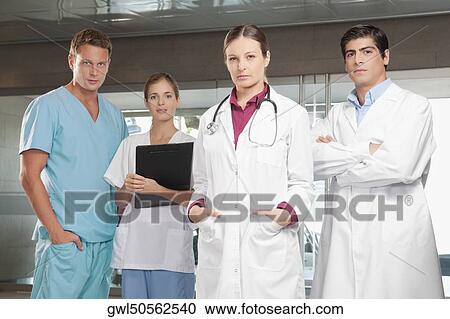 Doctors standing together View Large Photo Image Stock Image - Doctors standing together. Fotosearch