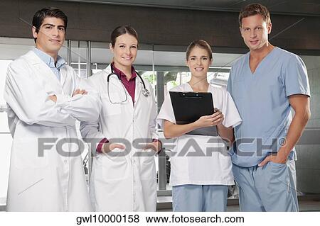 Doctors standing together View Large Photo Image Stock Photo - Doctors standing together. Fotosearch