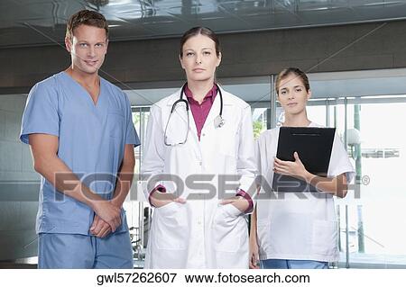 Doctors standing together View Large Photo Image Stock Photo - Doctors standing together. Fotosearch