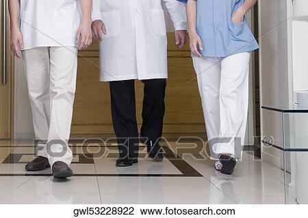 Doctors walking in the hospital View Large Photo Image Stock Image - Doctors walking in the hospital. Fotosearch