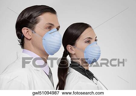Doctors wearing flu masks View Large Photo Image Stock Photo - Doctors wearing flu masks. Fotosearch
