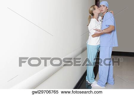 Female and a male nurse romancing in a hospital corridor View Large Photo Image Stock Photography - Female and a male nurse romancing in a hospital corridor. Fotosearch