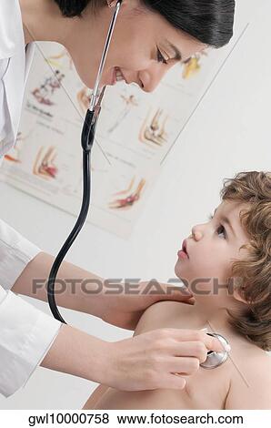 Female doctor examining a baby boy with a stethoscope View Large Photo Image Stock Photo - Female doctor examining a baby boy with a stethoscope. Fotosearch