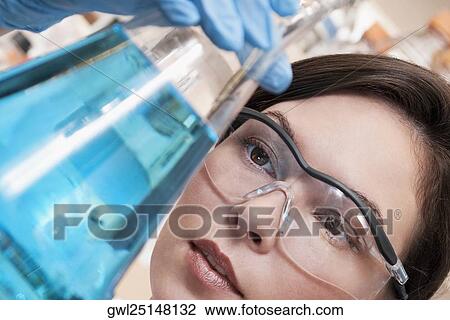 Female doctor holding a conical flask in a laboratory View Large Photo Image Stock Image - Female doctor holding a conical flask in a laboratory. Fotosearch