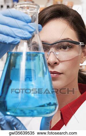 Female doctor holding a conical flask in a laboratory View Large Photo Image Stock Photography - Female doctor holding a conical flask in a laboratory. Fotosearch