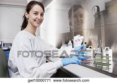 Female doctor holding a medical sample in a laboratory View Large Photo Image Stock Image - Female doctor holding a medical sample in a laboratory. Fotosearch
