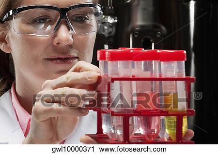 Female doctor holding medical samples in a laboratory View Large Photo Image Stock Image - Female doctor holding medical samples in a laboratory. Fotosearch