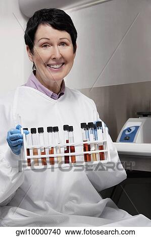 Female doctor holding medical samples in a laboratory View Large Photo Image Stock Image - Female doctor holding medical samples in a laboratory. Fotosearch