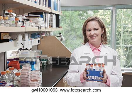 Female doctor holding medical samples in a laboratory View Large Photo Image Stock Image - Female doctor holding medical samples in a laboratory. Fotosearch