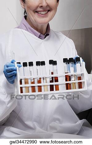Female doctor holding medical samples in a laboratory View Large Photo Image Stock Image - Female doctor holding medical samples in a laboratory. Fotosearch