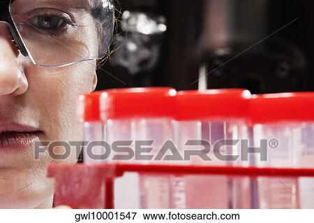 Female doctor holding medical samples in a laboratory View Large Photo Image Stock Photo - Female doctor holding medical samples in a laboratory. Fotosearch