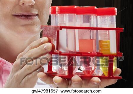 Female doctor holding medical samples in a laboratory View Large Photo Image Stock Photo - Female doctor holding medical samples in a laboratory. Fotosearch
