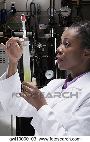 Female doctor researching in a laboratory View Large Photo Image Stock Image - Female doctor researching in a laboratory. Fotosearch