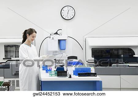 Female doctor researching in a laboratory View Large Photo Image Stock Image - Female doctor researching in a laboratory. Fotosearch