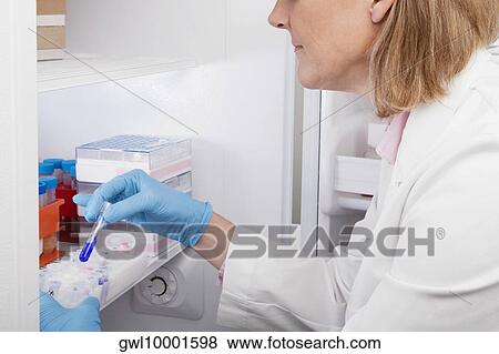 Stock Photo - Female doctor researching in a laboratory. Fotosearch
