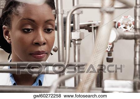Female doctor researching in a laboratory View Large Photo Image Stock Photo - Female doctor researching in a laboratory. Fotosearch