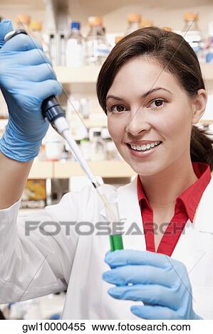 Female doctor researching in a laboratory View Large Photo Image Stock Photography - Female doctor researching in a laboratory. Fotosearch