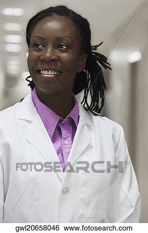 Female doctor smiling in a hospital View Large Photo Image Stock Photograph - Female doctor smiling in a hospital. Fotosearch