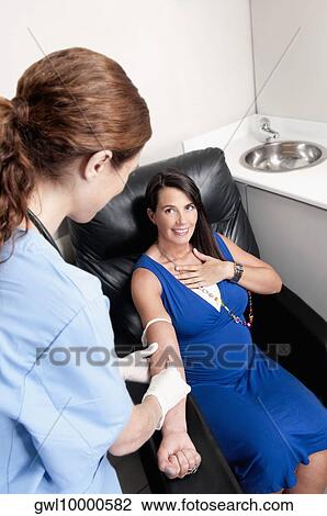Female doctor taking blood sample of a pregnant woman View Large Photo Image Stock Image - Female doctor taking blood sample of a pregnant woman. Fotosearch