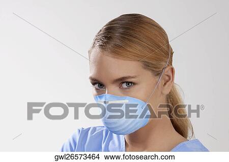Female doctor wearing a flu mask View Large Photo Image Picture - Female doctor wearing a flu mask. Fotosearch