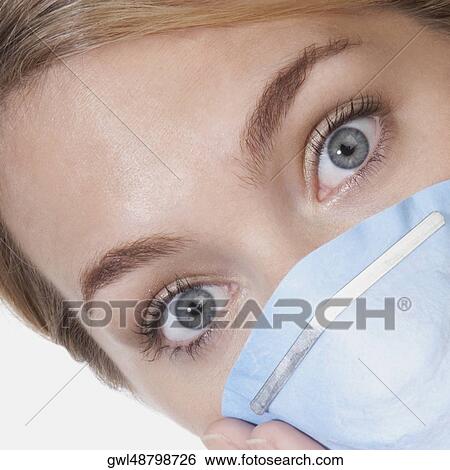 Female doctor wearing a flu mask View Large Photo Image Stock Photograph - Female doctor wearing a flu mask. Fotosearch