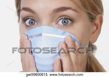 Female doctor wearing a flu mask View Large Photo Image Stock Photography - Female doctor wearing a flu mask. Fotosearch