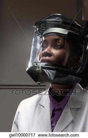 Female doctor wearing a protective gear in a laboratory View Large Photo Image Stock Photo - Female doctor wearing a protective gear in a laboratory. Fotosearch