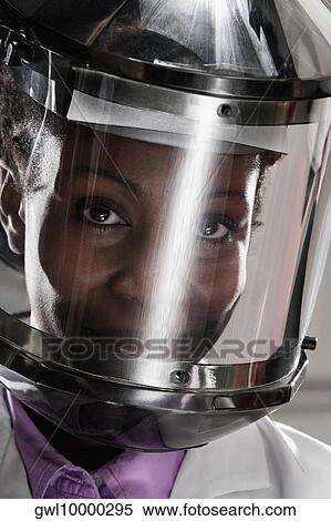 Female doctor wearing a protective gear in a laboratory View Large Photo Image Stock Photography - Female doctor wearing a protective gear in a laboratory. Fotosearch
