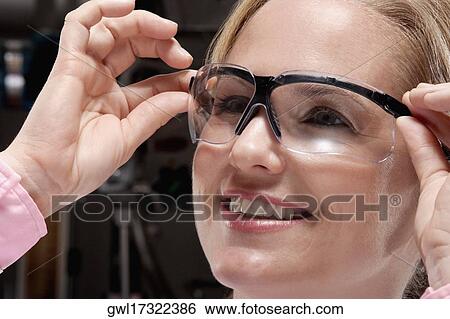 Female doctor wearing a protective eyewear View Large Photo Image Stock Photograph - Female doctor wearing a protective eyewear. Fotosearch