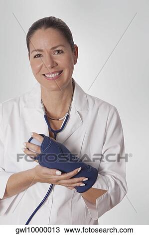 Female doctor wearing a wrist brace View Large Photo Image Stock Image - Female doctor wearing a wrist brace. Fotosearch