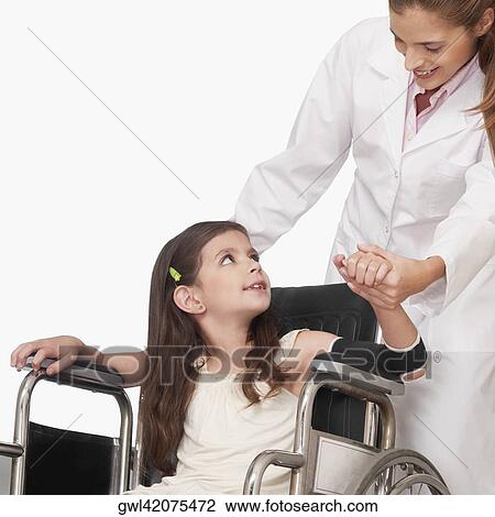 Female doctor with a patient in a wheelchair View Large Photo Image Stock Image - Female doctor with a patient in a wheelchair. Fotosearch