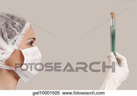 Female lab technician analyzing a sample in a test tube View Large Photo Image Stock Photography - Female lab technician analyzing a sample in a test tube. Fotosearch