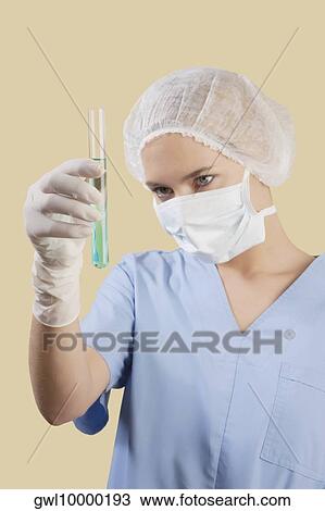 Female lab technician analyzing a test tube View Large Photo Image Stock Image - Female lab technician analyzing a test tube. Fotosearch