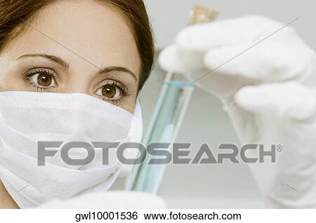 Female lab technician analyzing sample in test tube View Large Photo Image Stock Photograph - Female lab technician analyzing sample in test tube. Fotosearch