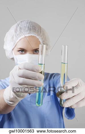Female lab technician analyzing test tubes View Large Photo Image Stock Image - Female lab technician analyzing test tubes. Fotosearch