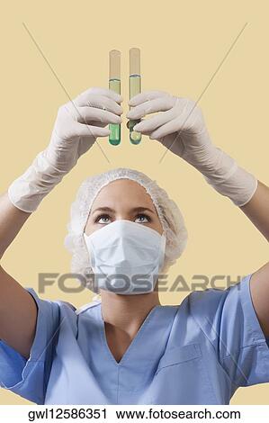 Female lab technician analyzing test tubes View Large Photo Image Stock Image - Female lab technician analyzing test tubes. Fotosearch