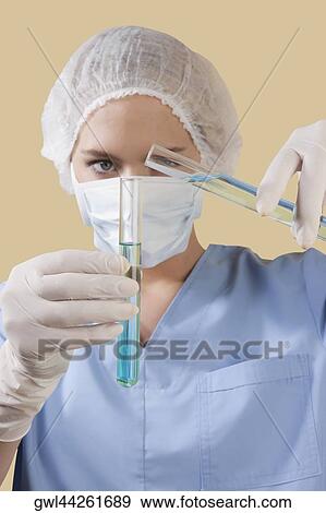 Female lab technician analyzing test tubes View Large Photo Image Stock Photo - Female lab technician analyzing test tubes. Fotosearch