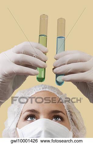 Female lab technician analyzing test tubes View Large Photo Image Stock Photograph - Female lab technician analyzing test tubes. Fotosearch