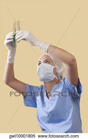 Female lab technician analyzing test tubes View Large Photo Image Stock Photography - Female lab technician analyzing test tubes. Fotosearch