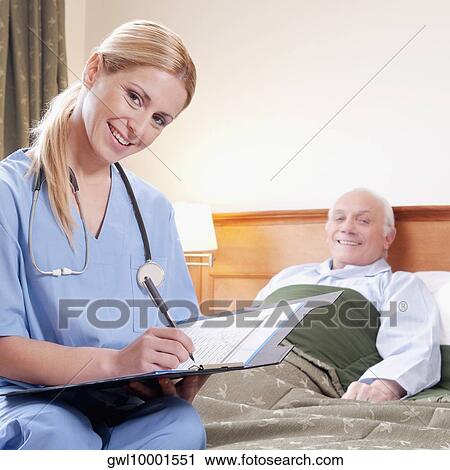Female nurse preparing the medical report of a patient View Large Photo Image Stock Image - Female nurse preparing the medical report of a patient. Fotosearch