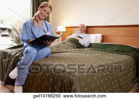 Female nurse preparing the medical report of a patient View Large Photo Image Stock Image - Female nurse preparing the medical report of a patient. Fotosearch